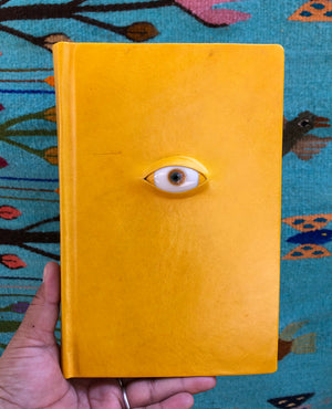 NIDIA ROJAS LEATHER NOTEBOOK WITH EYE